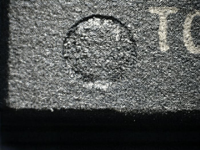 Counterfeit OP279GP indent filled and uneven compared with a clean manufacturer cavity