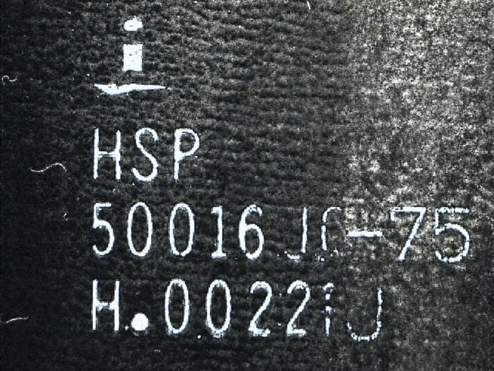 HSP50016JC-75 after an acetone wash on one side, revealing a top coat over the molded plastic